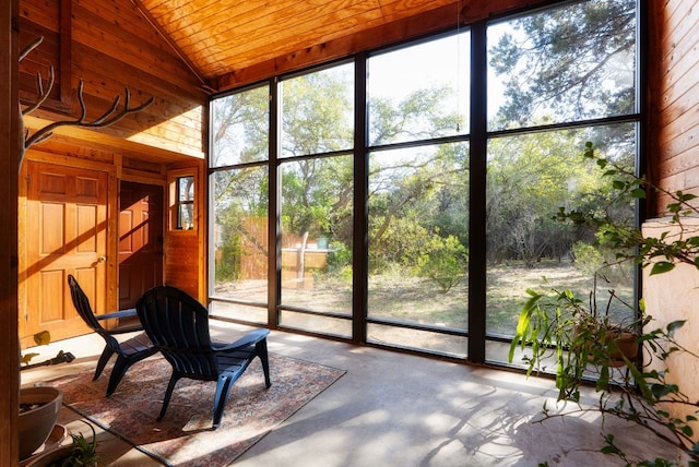 unfurnished sunroom featuring wooden ceiling and vaulted ceiling