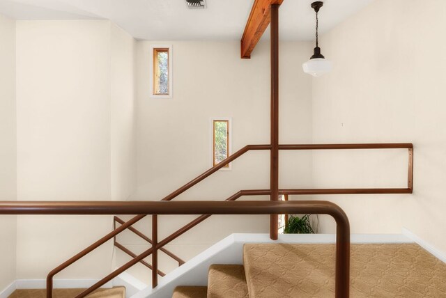603 N Tumbleweed Trl, Austin, TX 78733 - stairs featuring healthy amount of natural light and beam ceiling