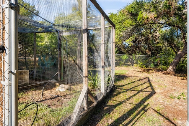 view of yard with an outdoor structure, fence, and exterior structure