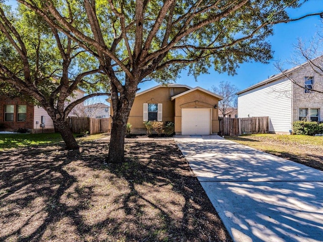 171 Beech Dr, Kyle, TX 78640 - ranch-style house with a garage, stucco siding, and concrete driveway