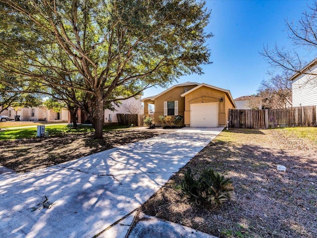 171 Beech Dr, Kyle, TX 78640 - ranch-style house with a garage, stucco siding, and concrete driveway