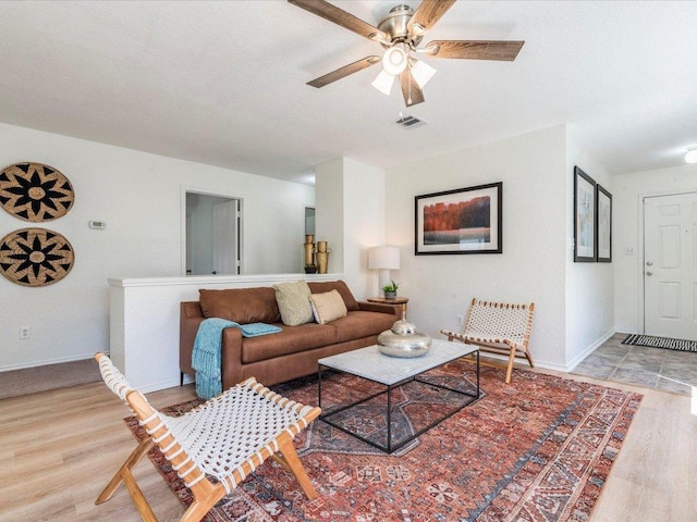 171 Beech Dr, Kyle, TX 78640 - living area with light wood-type flooring, a ceiling fan, and baseboards