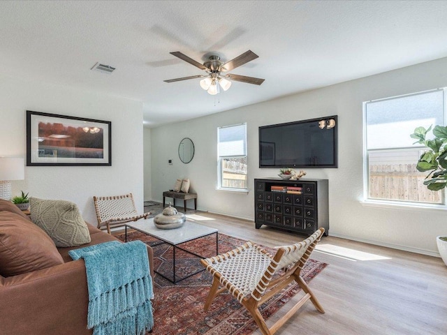 171 Beech Dr, Kyle, TX 78640 - living area with wood finished floors, ceiling fan, and baseboards