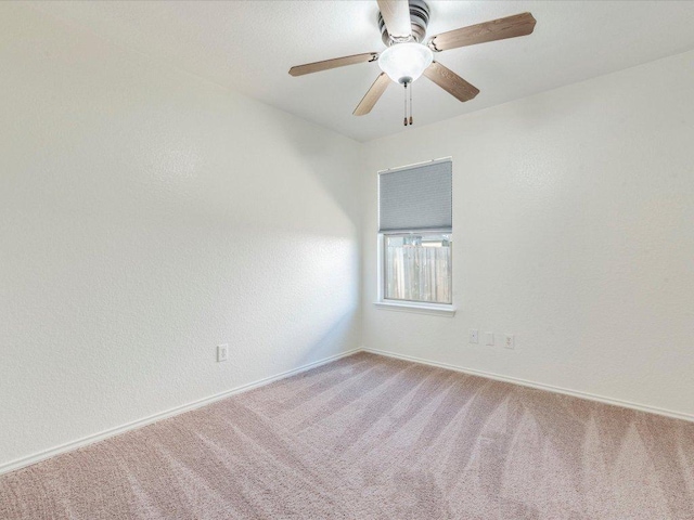 171 Beech Dr, Kyle, TX 78640 - carpeted empty room with baseboards and a ceiling fan