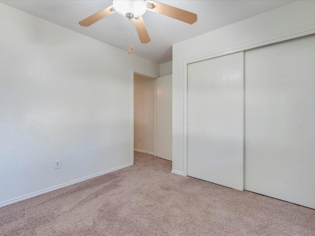 171 Beech Dr, Kyle, TX 78640 - unfurnished bedroom with carpet, a closet, and a ceiling fan