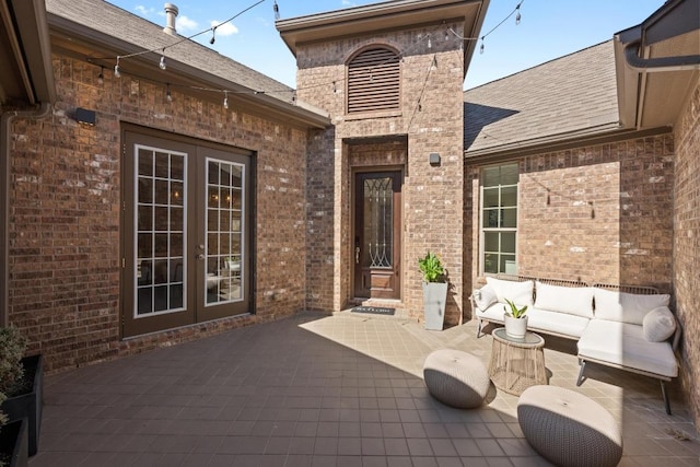 view of patio featuring an outdoor living space and french doors