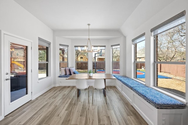 unfurnished sunroom with a chandelier