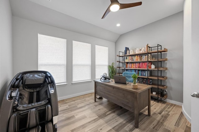 office featuring light wood finished floors, lofted ceiling, recessed lighting, a ceiling fan, and baseboards