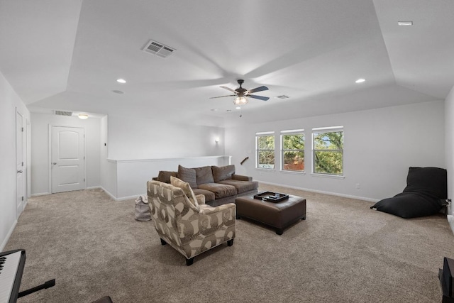 carpeted living room featuring recessed lighting, visible vents, lofted ceiling, and baseboards