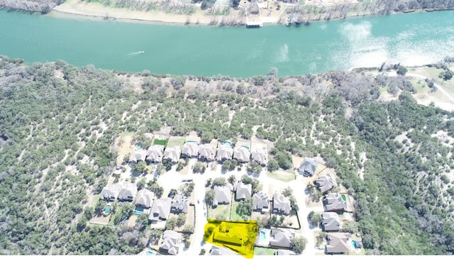 birds eye view of property with a water view and a residential view