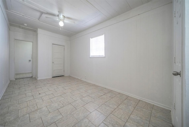 empty room featuring attic access