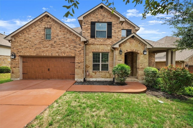 5305 Cardinal Flower Cv, Spicewood, TX 78669 - traditional home featuring stone siding, concrete driveway, a garage, and brick siding