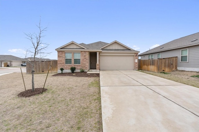 ranch-style house with concrete driveway, an attached garage, fence, board and batten siding, and brick siding