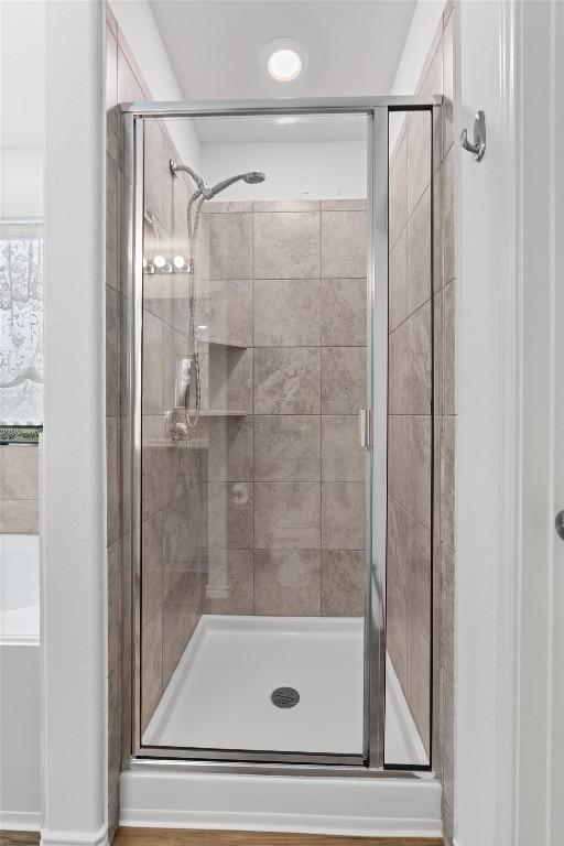 full bathroom with a shower stall