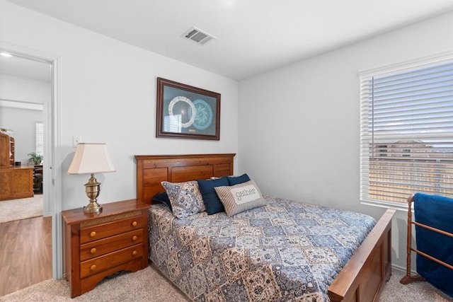 bedroom with visible vents