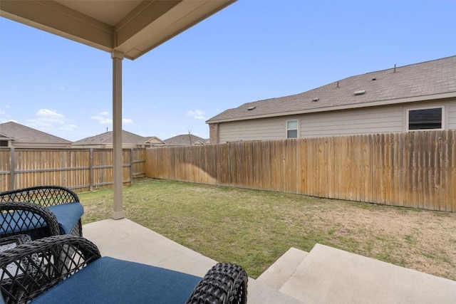 view of yard with a patio area and a fenced backyard