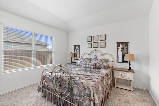 carpeted bedroom featuring baseboards