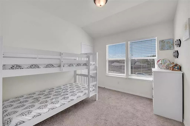 bedroom with carpet and vaulted ceiling