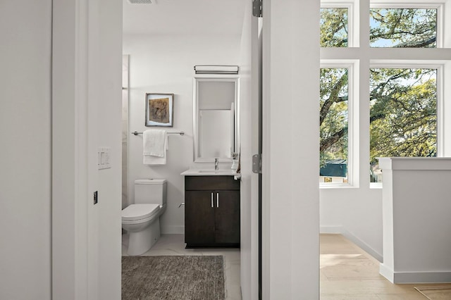 5107 Menchaca Rd Unit 11, Austin, TX 78745 - bathroom featuring vanity and baseboards