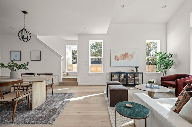 5107 Menchaca Rd Unit 11, Austin, TX 78745 - living room with light wood-style floors, recessed lighting, and a chandelier