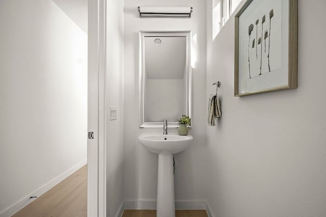 5107 Menchaca Rd Unit 11, Austin, TX 78745 - bathroom featuring baseboards and wood finished floors