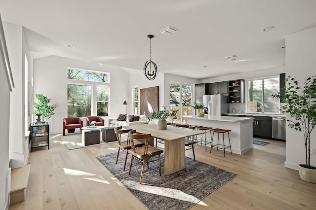 5107 Menchaca Rd Unit 11, Austin, TX 78745 - dining area with light wood-style floors and recessed lighting