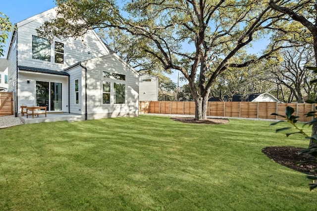 view of yard with a patio area and a fenced backyard