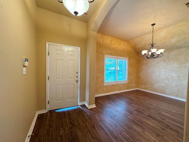 foyer entrance with visible vents, baseboards, and wood finished floors