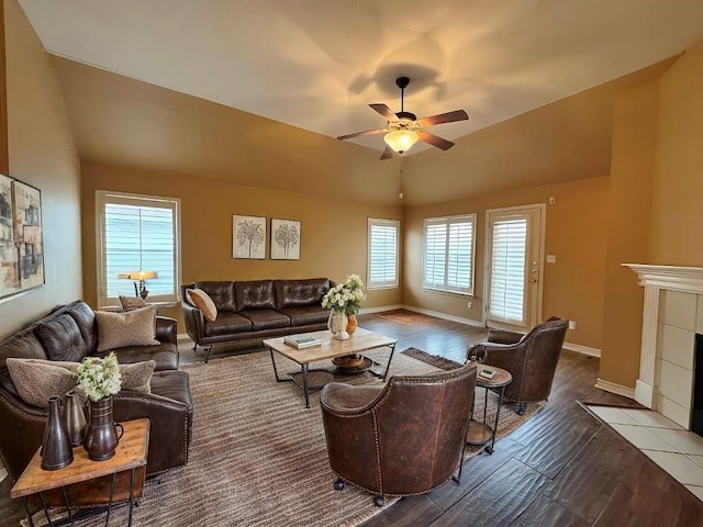 627 Columbine Ave, Cedar Park, TX 78613 - living room with vaulted ceiling, ceiling fan, wood finished floors, baseboards, and a fireplace