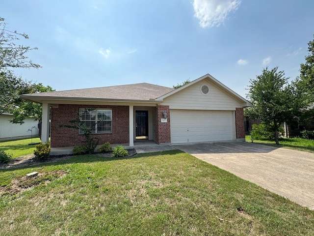 627 Columbine Ave, Cedar Park, TX 78613 - single story home with a garage, brick siding, driveway, and a front yard