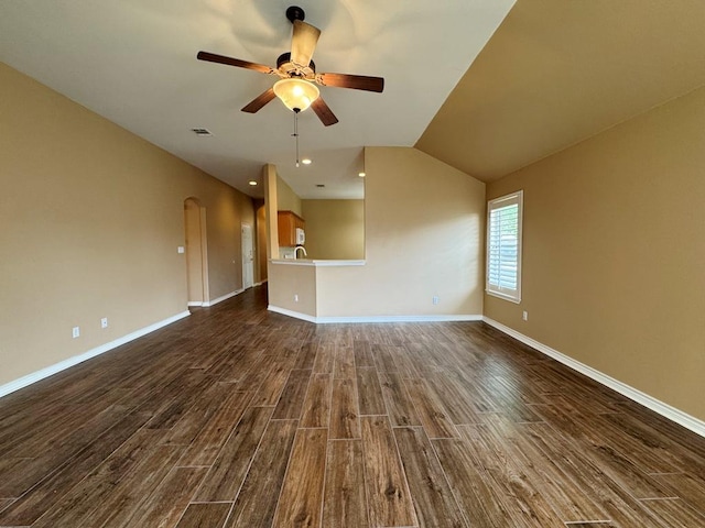 627 Columbine Ave, Cedar Park, TX 78613 - unfurnished living room with dark wood-style flooring, a ceiling fan, baseboards, recessed lighting, and lofted ceiling