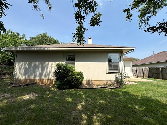 627 Columbine Ave, Cedar Park, TX 78613 - rear view of house with a chimney