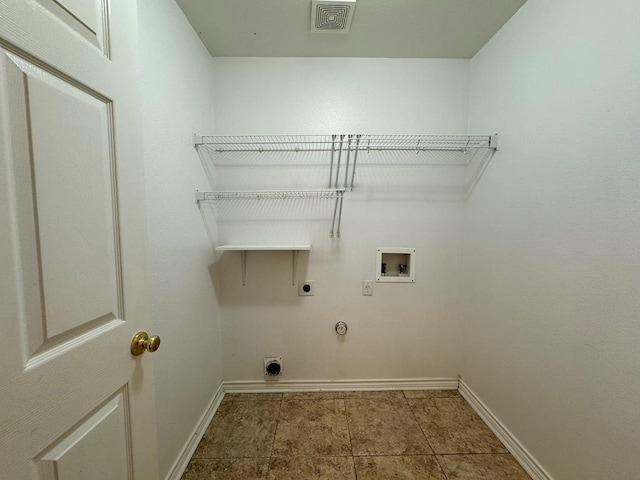 627 Columbine Ave, Cedar Park, TX 78613 - washroom with hookup for an electric dryer, washer hookup, gas dryer hookup, baseboards, and tile patterned floors
