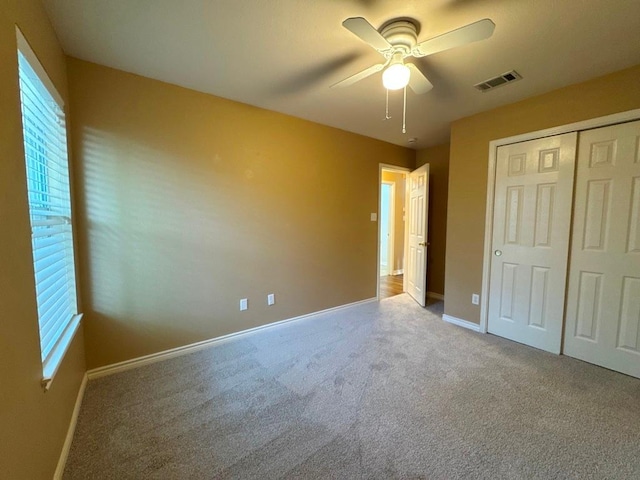 627 Columbine Ave, Cedar Park, TX 78613 - unfurnished bedroom with carpet, baseboards, a closet, and ceiling fan