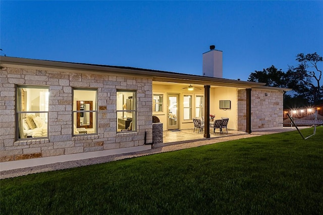 5608 Arroyo Rd, Austin, TX 78734 - back of house featuring a chimney, a yard, ceiling fan, a patio, and stone siding