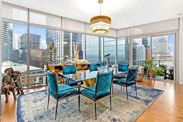 interior space with a healthy amount of sunlight, a notable chandelier, and a city view