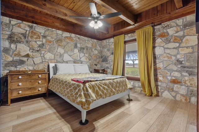 bedroom featuring ceiling fan, wood ceiling, beamed ceiling, and wood finished floors