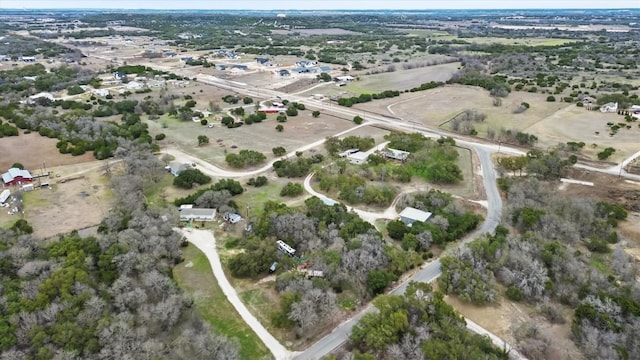 birds eye view of property with a rural view