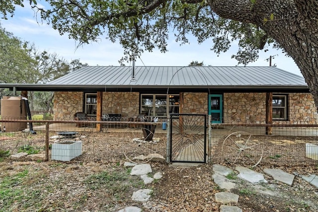 view of front of home with a standing seam roof and metal roof