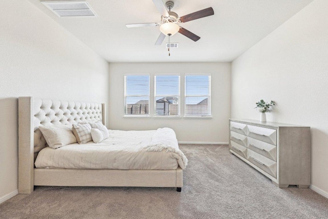 bedroom with baseboards, ceiling fan, visible vents, and light colored carpet