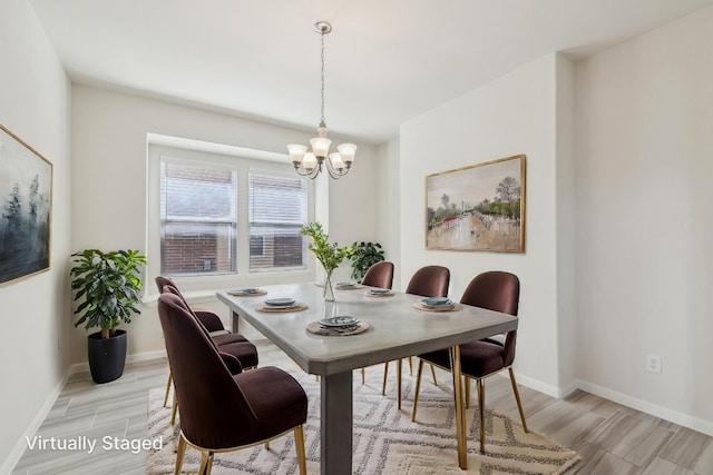 20417 Whimbrel Ct, Pflugerville, TX 78660 - dining room featuring a chandelier, baseboards, and light wood-style floors