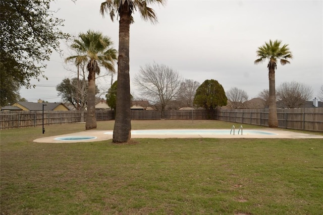 view of home's community featuring a fenced backyard, a yard, and a swimming pool