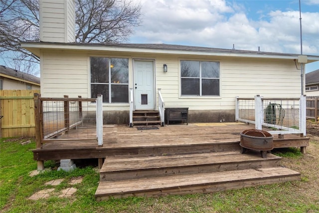 121 Winecup Path, Cedar Creek, TX 78612 - back of property featuring a chimney, a deck, and entry steps