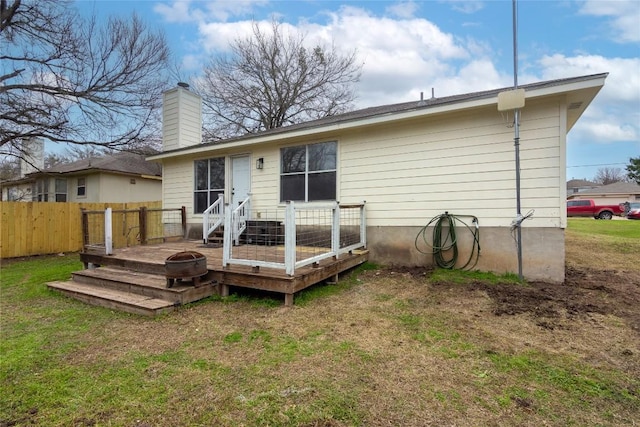 121 Winecup Path, Cedar Creek, TX 78612 - rear view of house featuring a wooden deck and a chimney