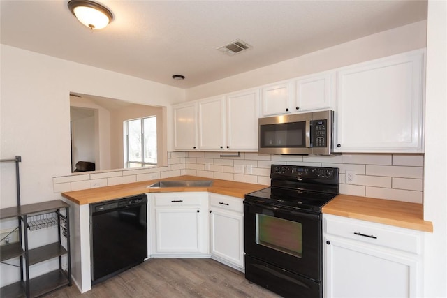 121 Winecup Path, Cedar Creek, TX 78612 - kitchen featuring black appliances, wood counters, and decorative backsplash