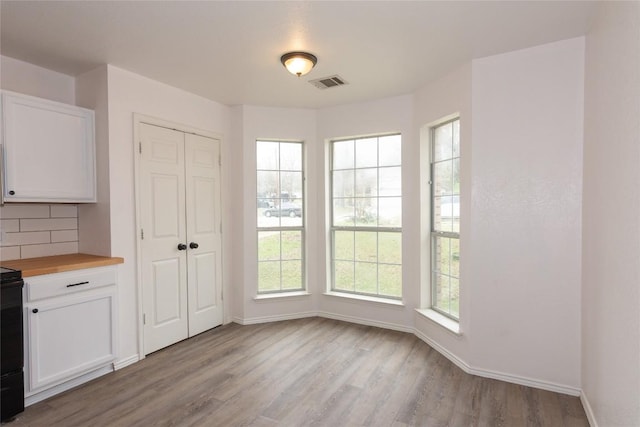 121 Winecup Path, Cedar Creek, TX 78612 - unfurnished dining area featuring light wood finished floors and baseboards