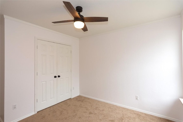 121 Winecup Path, Cedar Creek, TX 78612 - unfurnished bedroom with light colored carpet, a closet, ornamental molding, and a ceiling fan