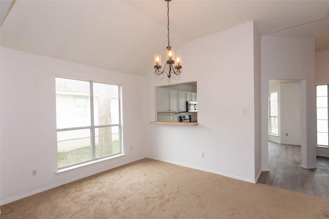 121 Winecup Path, Cedar Creek, TX 78612 - unfurnished dining area with a chandelier, lofted ceiling, and carpet flooring