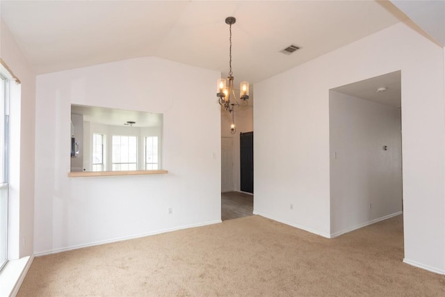 121 Winecup Path, Cedar Creek, TX 78612 - carpeted empty room with vaulted ceiling and a chandelier