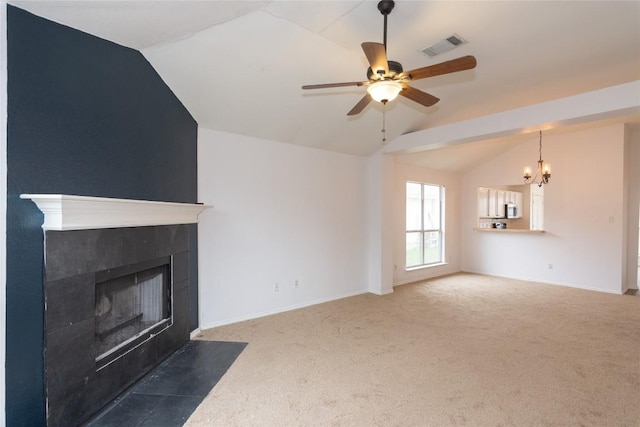 121 Winecup Path, Cedar Creek, TX 78612 - unfurnished living room featuring lofted ceiling, a tile fireplace, a chandelier, carpet floors, and ceiling fan